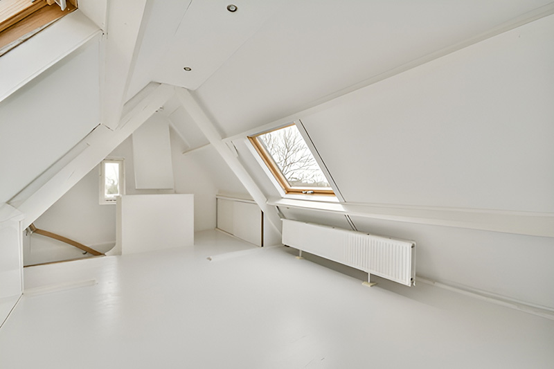 attic with white painted walls