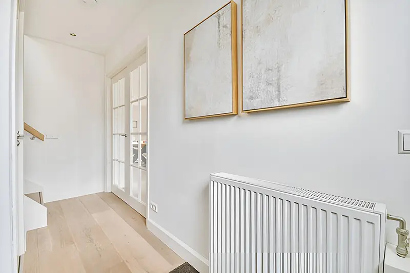 hallway area with white painted walls