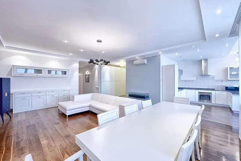 sitting room with painted white walls and white furniture